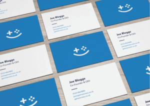 Multiple business card laid out showing a logo and contact details