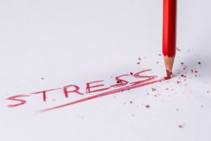 The word Stress written by a snapped crayon