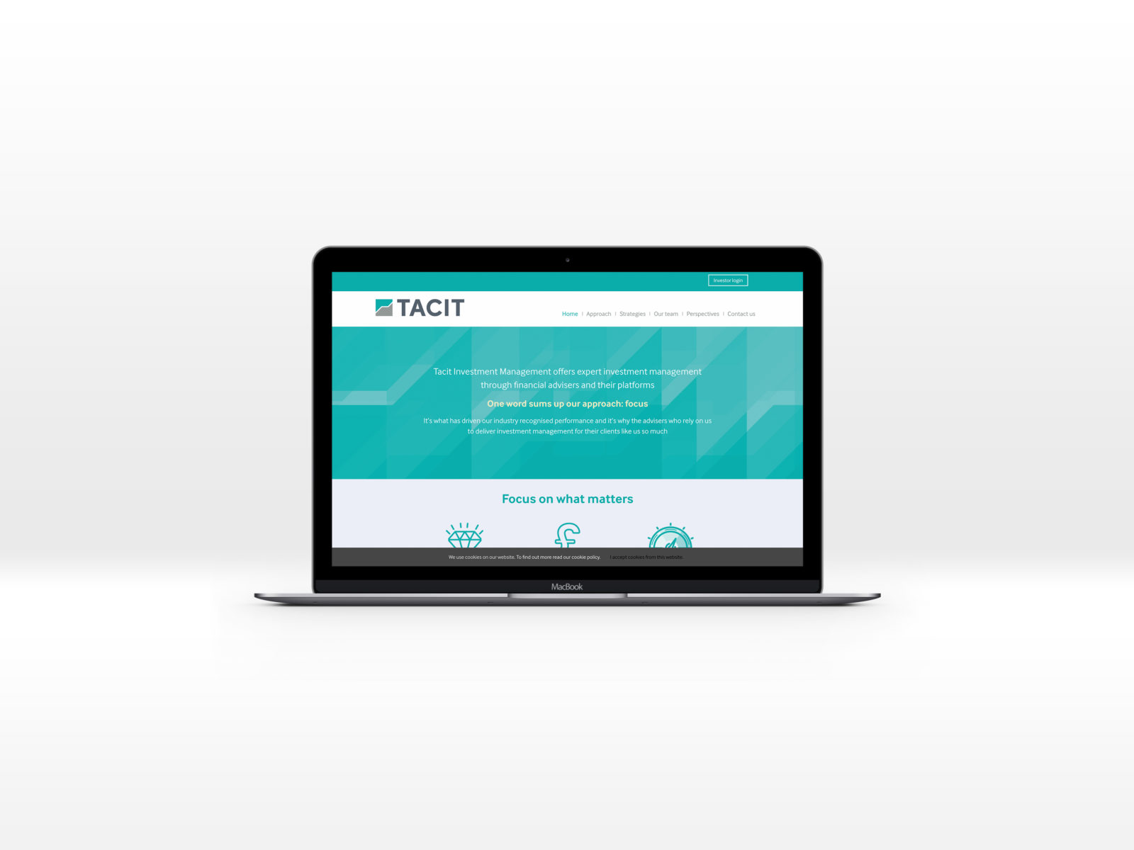 Tacit homepage displayed on a Mac laptop computer