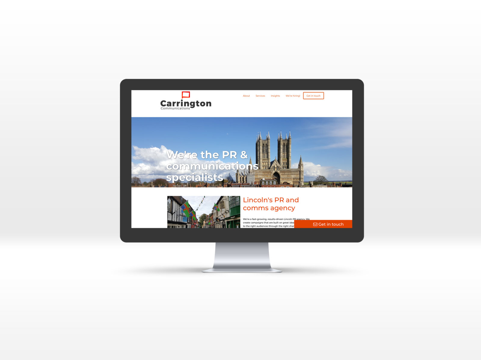 Carrington Communications Home page displayed on a Mac desktop computer