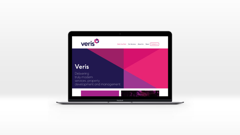 Veris homepage displayed on a Macbook laptop