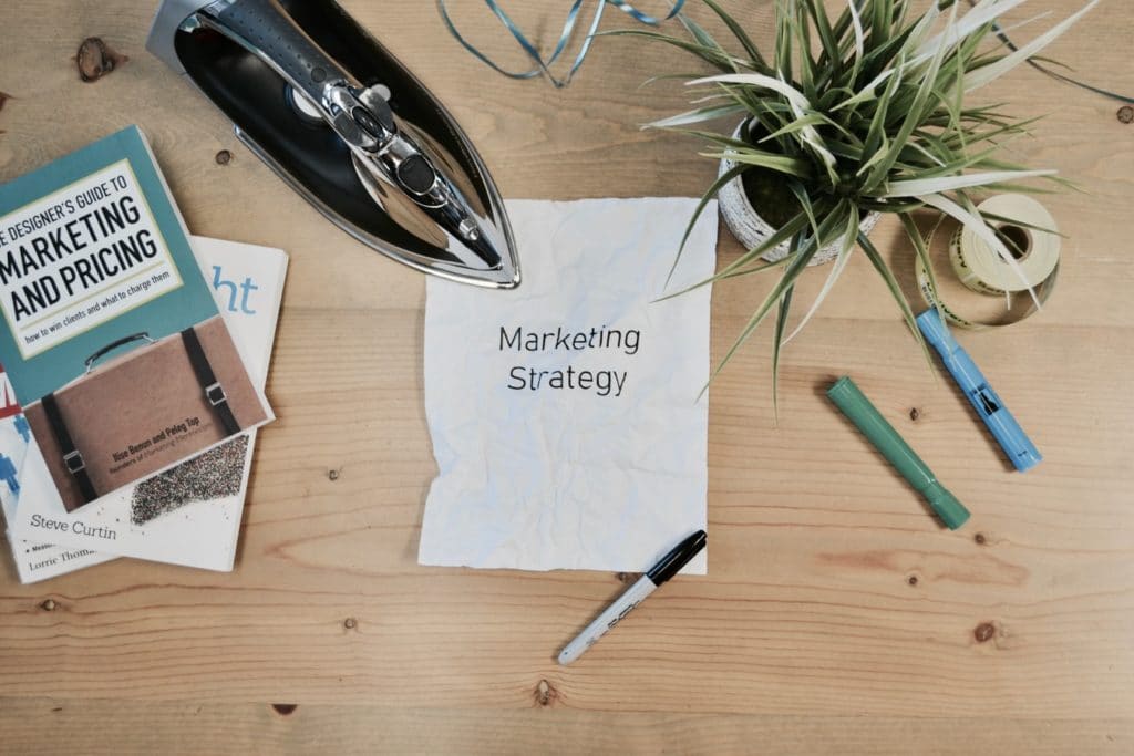 note on table that reads marketing strategy
