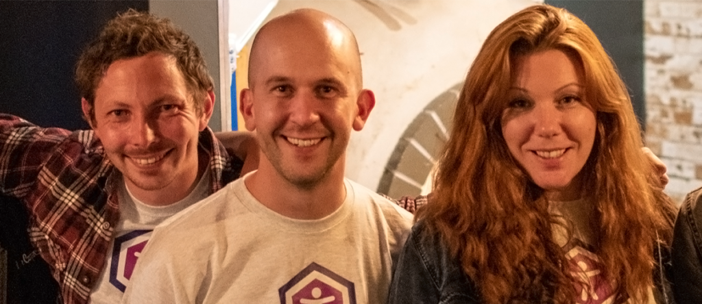 James Hall, Tom Miller, Zara Gemmell all stood together smiling