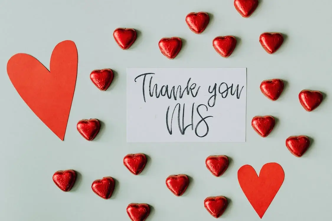 a sign saying'thank you NHS', surrounded by lovehearts