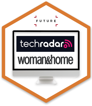 A desktop monitor is displaying techradar and woman & home logos
