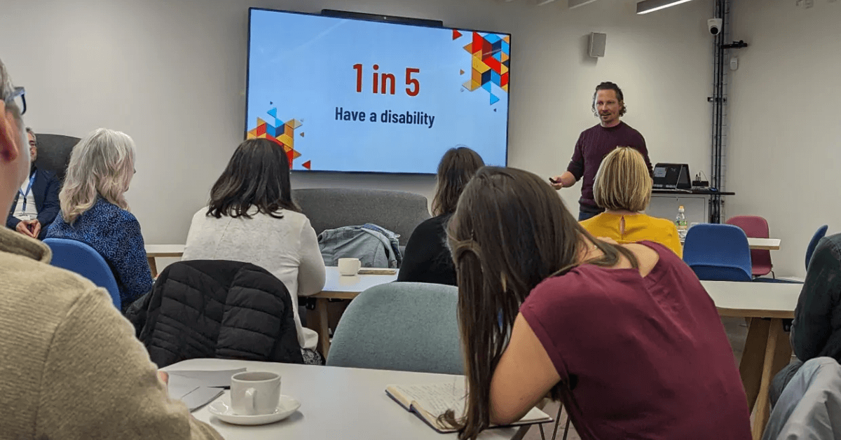 James Hall giving a presentation on digital accessibility