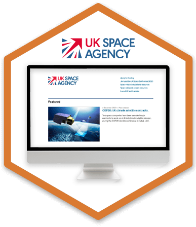 A desktop monitor is displaying the UK Space Agency's homepage